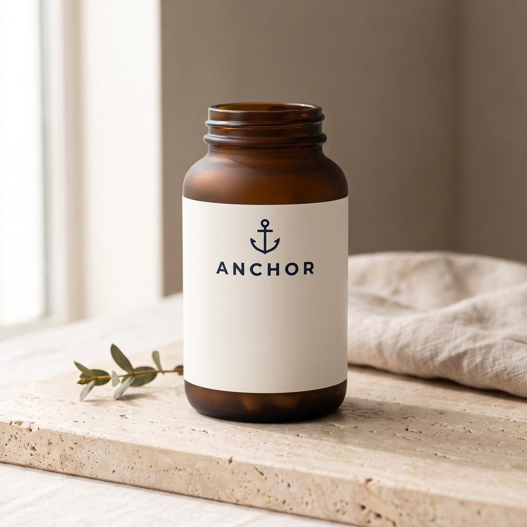 Anchor Gut Health Prebiotic Fiber navy tub on travertine stone with eucalyptus, natural window light