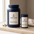Anchor High Protein Bundle — hero product shot on travertine with 'Whey Protein' label